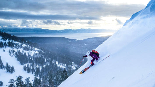 Powder skiing off Treeline Cirque at Alpine Meadows, with Lake Tahoe below.