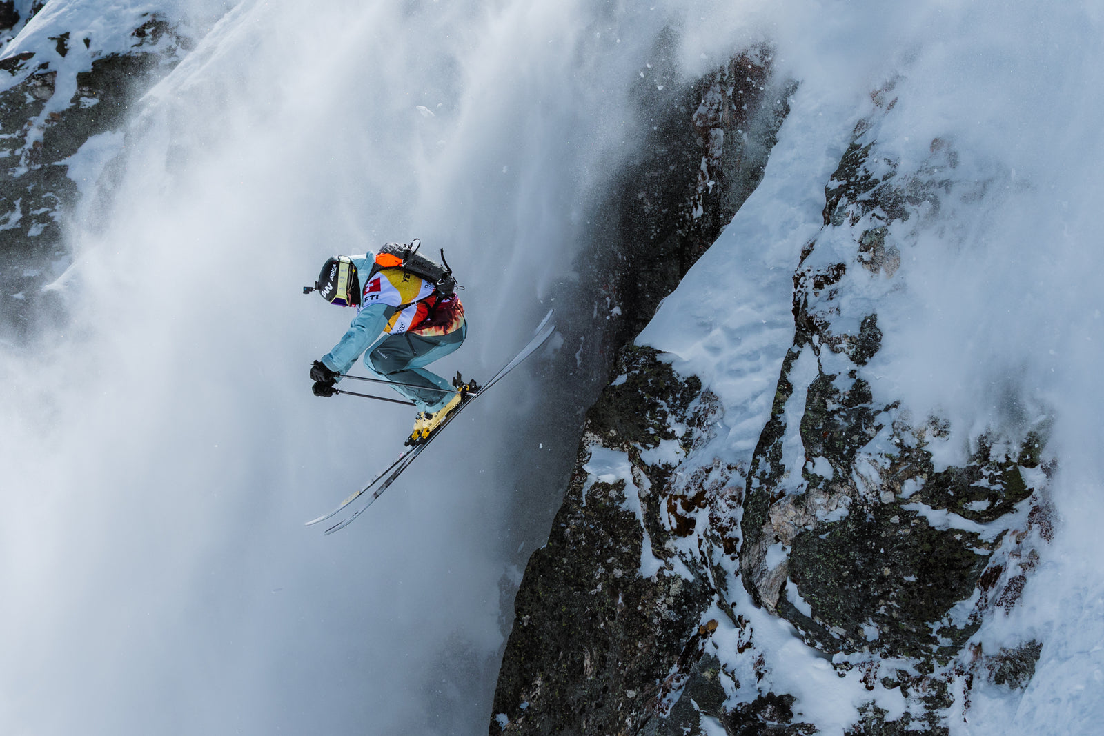 Skier beside a steep rock wall at Verbier, photographed by Jeremy Bernard at the 2026 Freeride World Tour